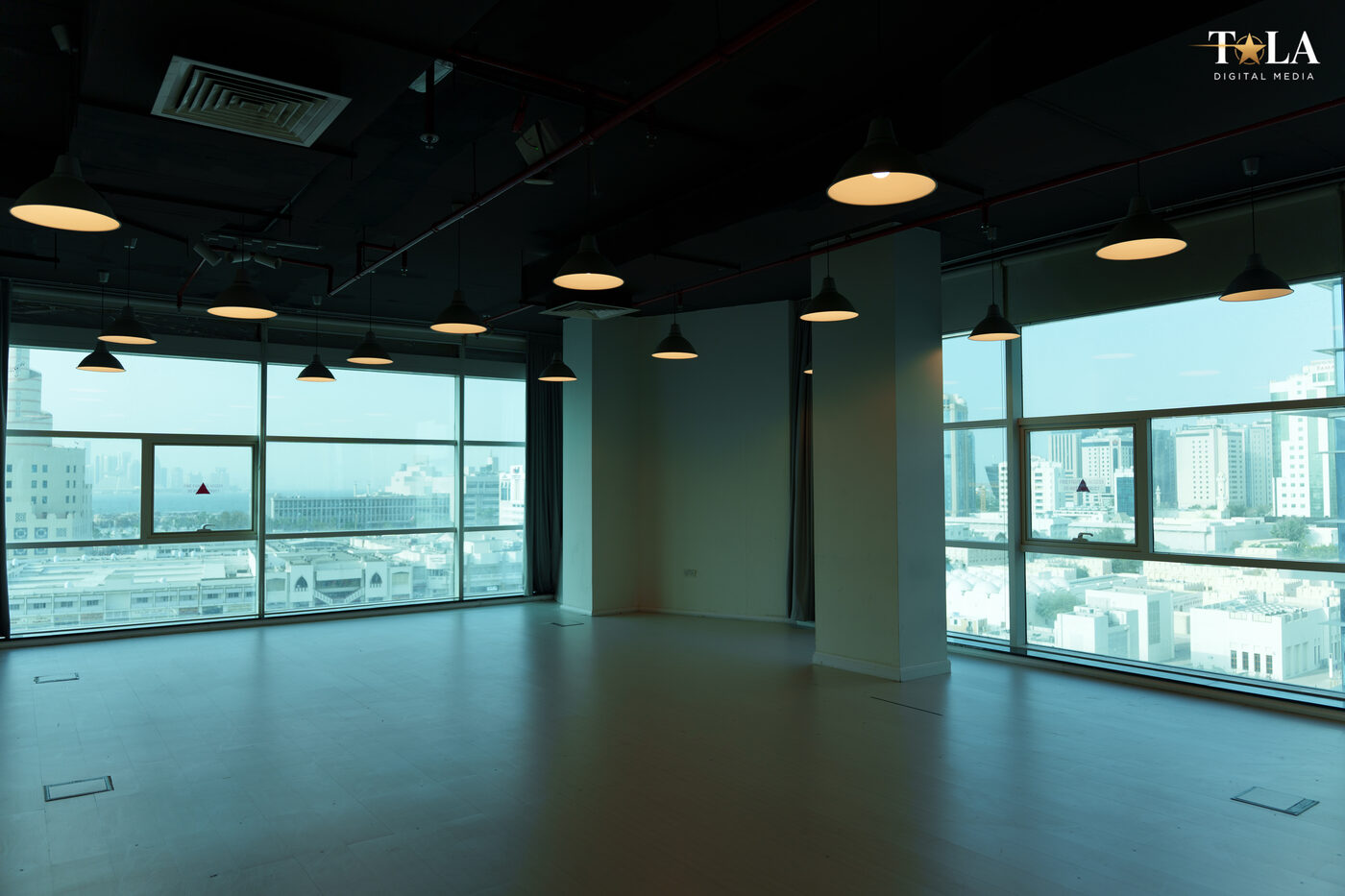 TALA studio space with floor-to-ceiling windows overlooking the Doha skyline